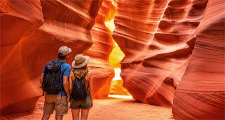 Visitors exploring the colorful sculpted sandstone passageways of Antelope Canyon near Page Arizona