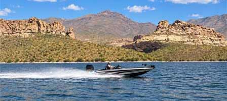 Boating on Apache Lake Arizona surrounded by desert mountains and scenic shoreline