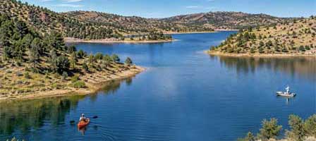 Black Canyon Lake Arizona with a kayaker and fisherman on the Mogollon Rim