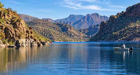 Bass fishing from a boat on Canyon Lake Arizona surrounded by desert canyon scenery