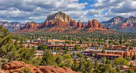 City of Sedona Downtown Sedona Arizona with shops and buildings surrounded by red rock scenery