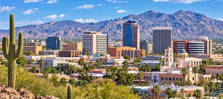 Downtown Tucson Arizona with city buildings and surrounding desert mountains