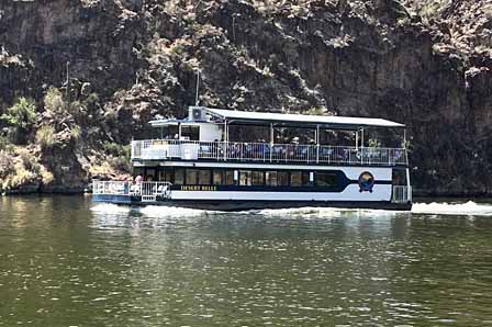 Desert Belle tour boat cruising through scenic canyon cliffs at Saguaro Lake Arizona
